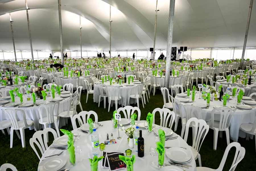 Hundreds of tables set for Shabbat dinner under the big tent